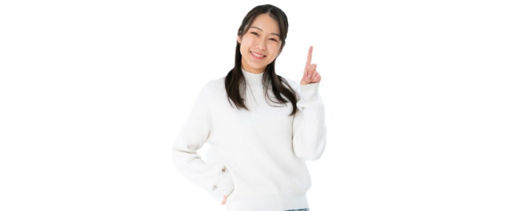 人差し指を立てる女性